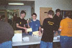 Queen Ann Archers share some laughs while earning services hours collating the latest edition of the Chapter By-laws